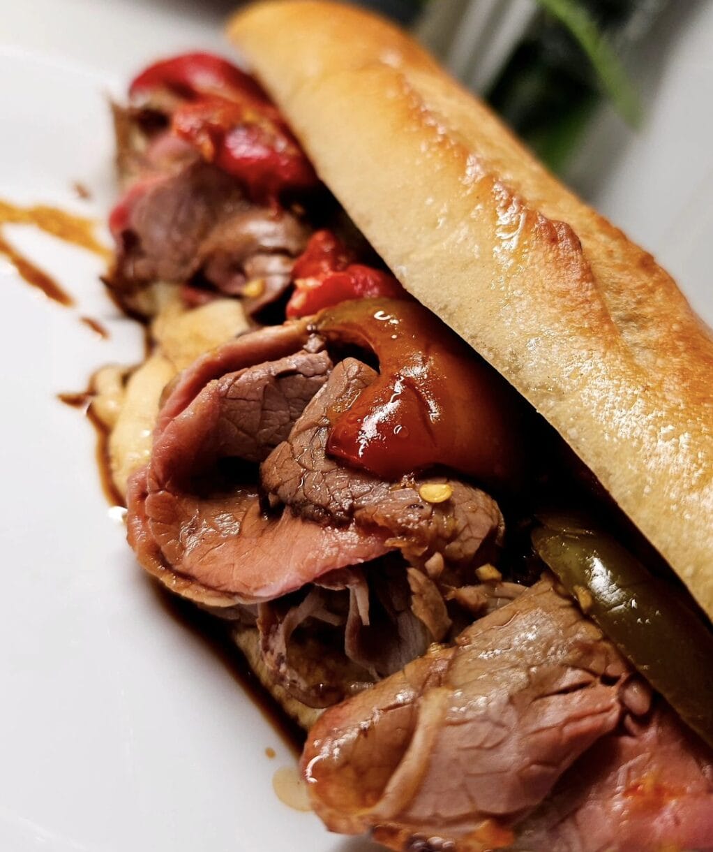 Roast beef with red and hot peppers on a toasted roll at Fiore's House of Quality in Hoboken